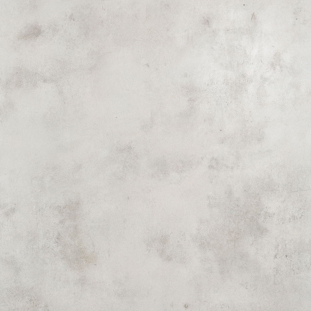 Interior del estudio en Santiago con luz natural, muros de hormigón y una estética minimalista.